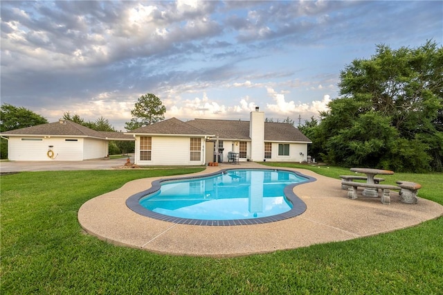 1701 Bradley Rd, College Station, TX 77845 - swimming pool featuring a patio and a lawn