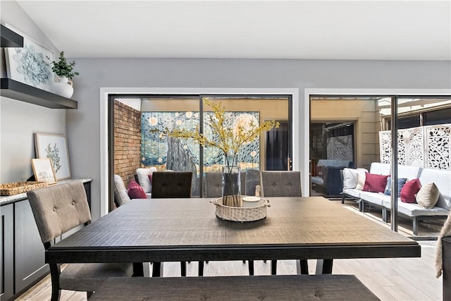 dining room with light wood-style flooring