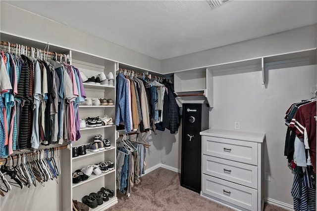 spacious closet featuring carpet flooring and visible vents