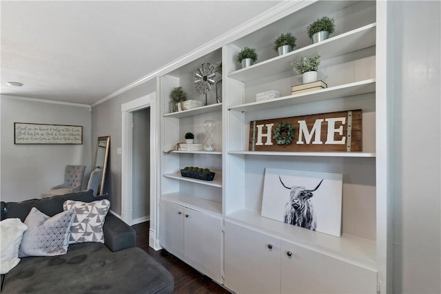 living room featuring built in features, baseboards, dark wood-type flooring, and crown molding