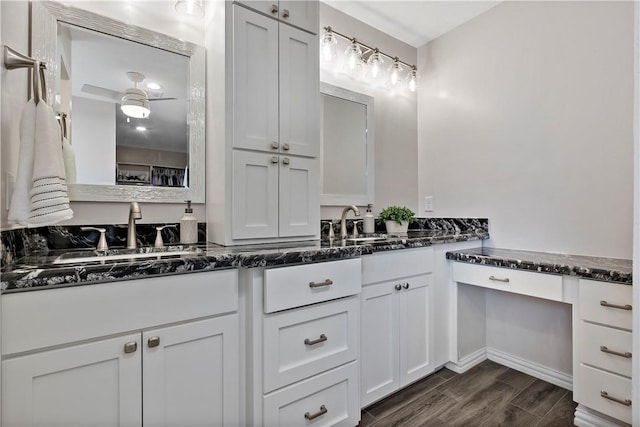 full bath with double vanity, ceiling fan, wood tiled floor, and a sink