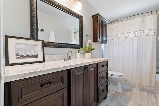 full bathroom with vanity, shower / bath combination with curtain, and toilet