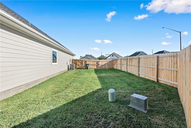 view of yard with central air condition unit