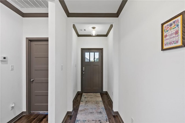 doorway with dark hardwood / wood-style floors and ornamental molding