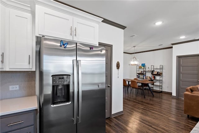 kitchen featuring white cabinetry, tasteful backsplash, stainless steel fridge with ice dispenser, a notable chandelier, and crown molding