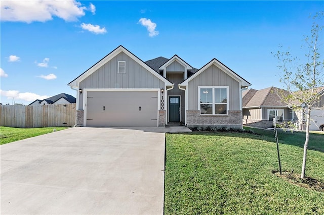 view of front of home with a front yard and a garage