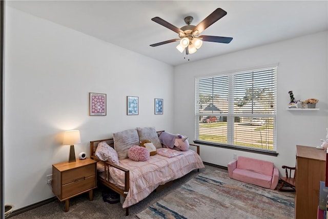 carpeted bedroom with ceiling fan