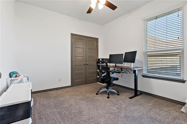 carpeted home office with ceiling fan