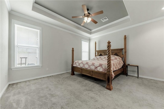 8305 Raintree Dr, College Station, TX 77845 - bedroom featuring a raised ceiling, multiple windows, carpet, and ornamental molding
