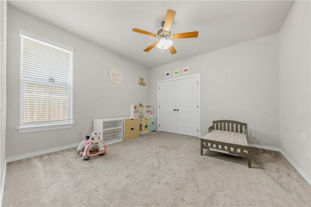 8305 Raintree Dr, College Station, TX 77845 - recreation room with carpet flooring, a ceiling fan, and baseboards