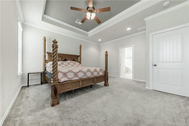 8305 Raintree Dr, College Station, TX 77845 - carpeted bedroom featuring a raised ceiling, ornamental molding, recessed lighting, ensuite bathroom, and baseboards