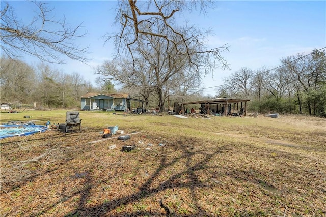 view of yard featuring a carport