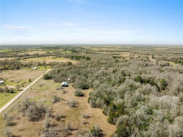 birds eye view of property featuring a rural view