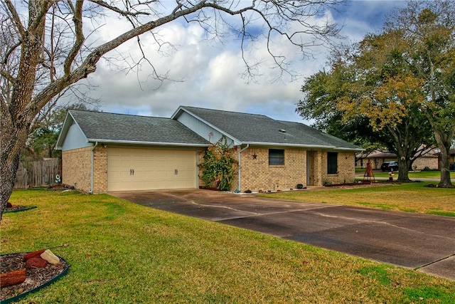 ranch-style house with a front yard and a garage