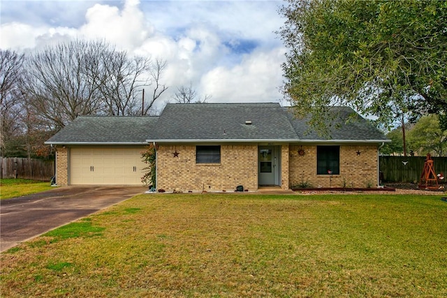 ranch-style house with a garage and a front yard