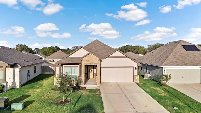 view of front of property with a garage and a front yard