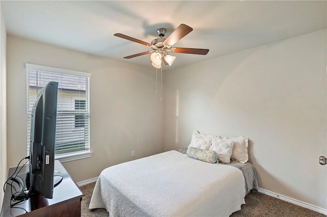 bedroom featuring dark carpet and ceiling fan