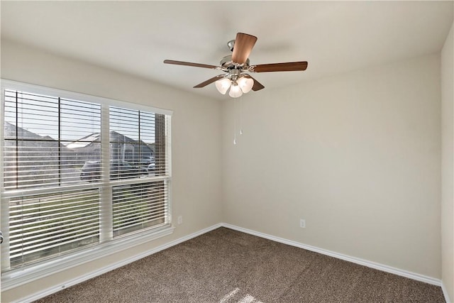 spare room featuring carpet flooring and ceiling fan