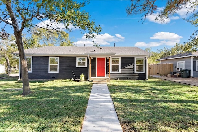 ranch-style house featuring a front yard