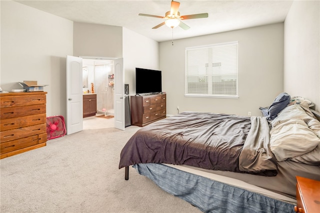 7906 Putter Pl, Navasota, TX 77868 - bedroom with light colored carpet, ensuite bathroom, and a ceiling fan