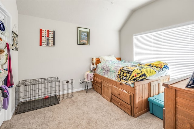 7906 Putter Pl, Navasota, TX 77868 - bedroom featuring lofted ceiling, light carpet, and baseboards