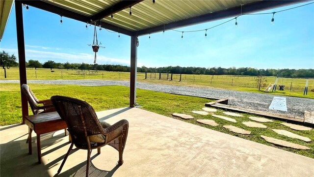 view of patio / terrace with a rural view