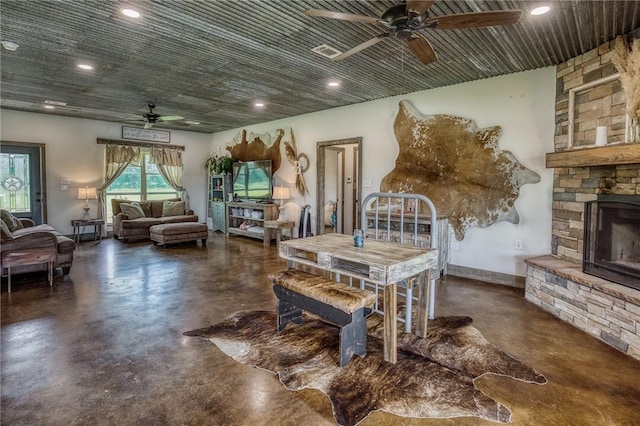 1850 Lcr 439, Groesbeck, TX 76667 - living room featuring ceiling fan, concrete flooring, a fireplace, and recessed lighting