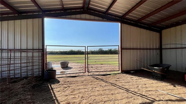 view of horse barn featuring a rural view