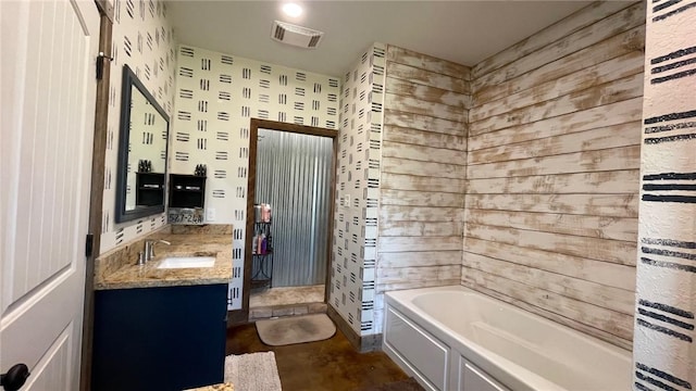 bathroom with vanity and a bathtub