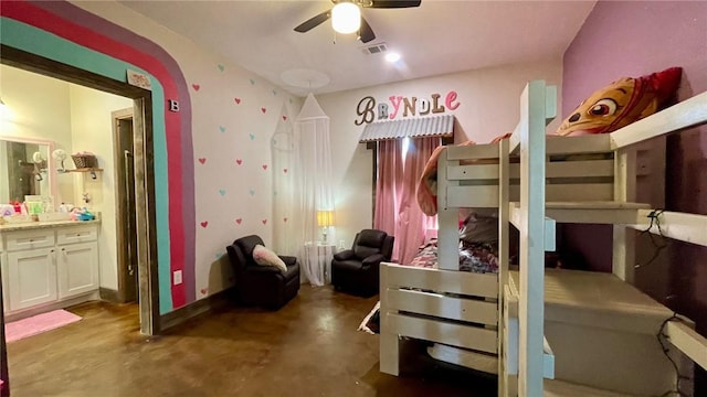 bedroom featuring ceiling fan and ensuite bathroom