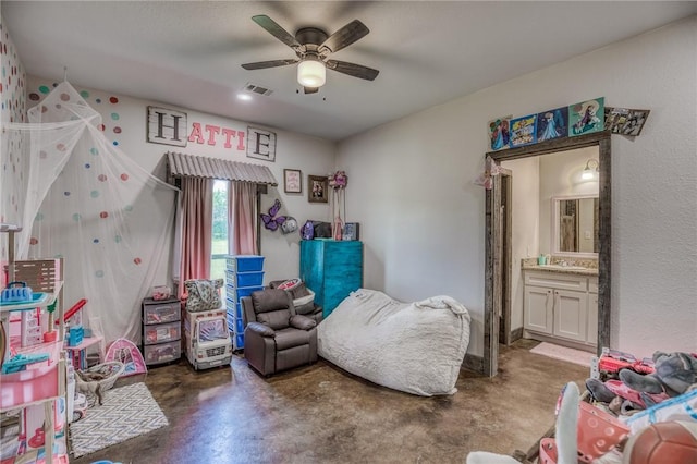 1850 Lcr 439, Groesbeck, TX 76667 - bedroom with concrete flooring, ensuite bathroom, a sink, and a ceiling fan