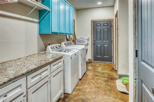 1850 Lcr 439, Groesbeck, TX 76667 - laundry area featuring cabinet space, separate washer and dryer, and a textured wall