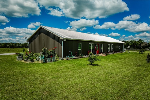 1850 Lcr 439, Groesbeck, TX 76667 - back of house featuring board and batten siding, a yard, metal roof, and a pole building