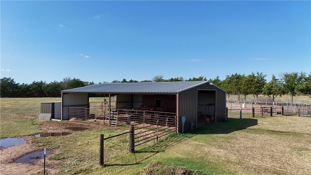 view of stable with a rural view