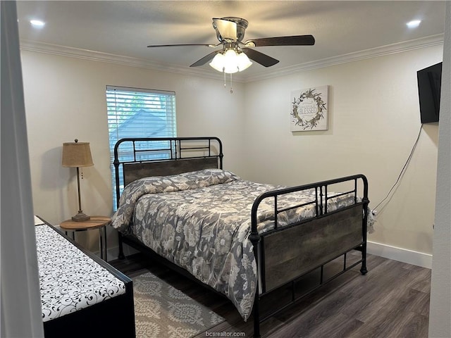 bedroom featuring wood finished floors, ornamental molding, baseboards, and ceiling fan