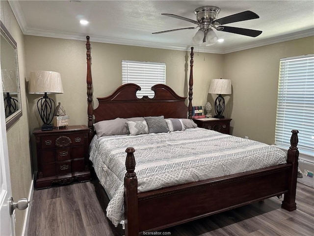bedroom featuring wood finished floors, a ceiling fan, and crown molding