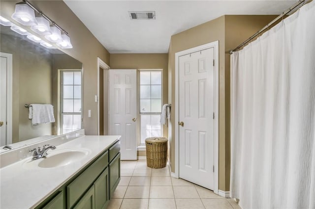 bathroom with tile patterned floors and vanity