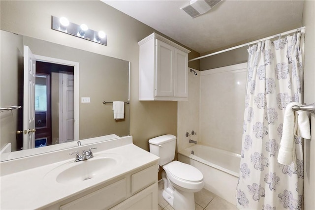 full bathroom featuring tile patterned flooring, vanity, toilet, and shower / bath combo with shower curtain