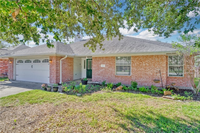 ranch-style house featuring a garage and a front lawn