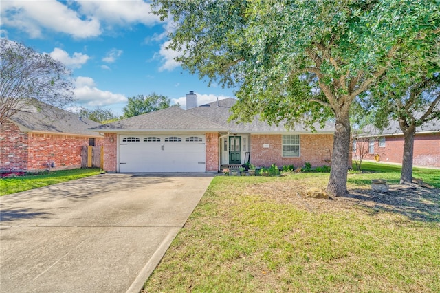 ranch-style home featuring a garage and a front lawn