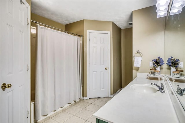 bathroom with tile patterned floors, vanity, and a shower with curtain