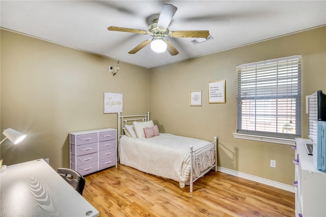 bedroom featuring light wood-type flooring and ceiling fan