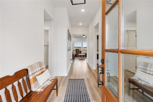 corridor featuring light hardwood / wood-style floors