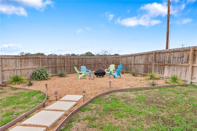 view of yard featuring an outdoor fire pit