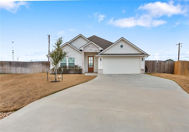 view of front of house with a garage and a front lawn