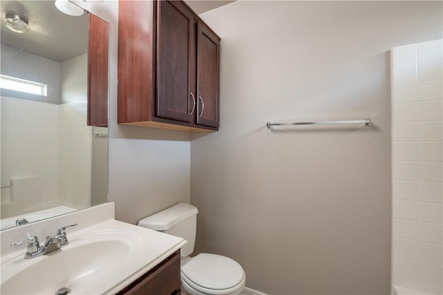 full bathroom with toilet, a shower, and vanity