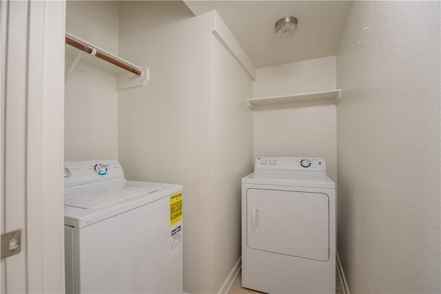 washroom with laundry area and washing machine and clothes dryer