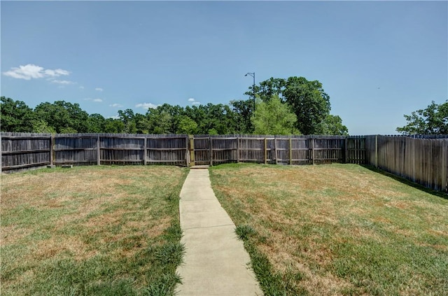 view of yard with a fenced backyard