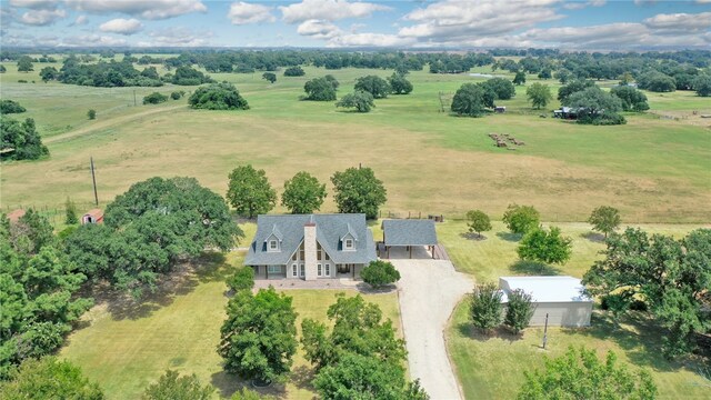 birds eye view of property featuring a rural view