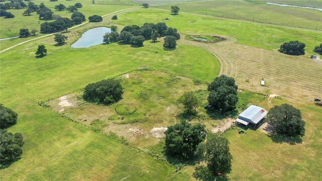 birds eye view of property featuring a rural view and a water view